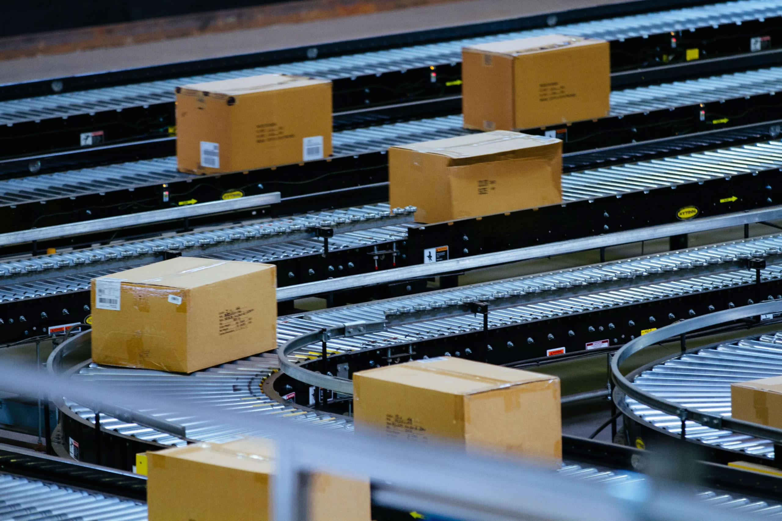 Live roller conveyors are powered to propel boxed and palletized products.
